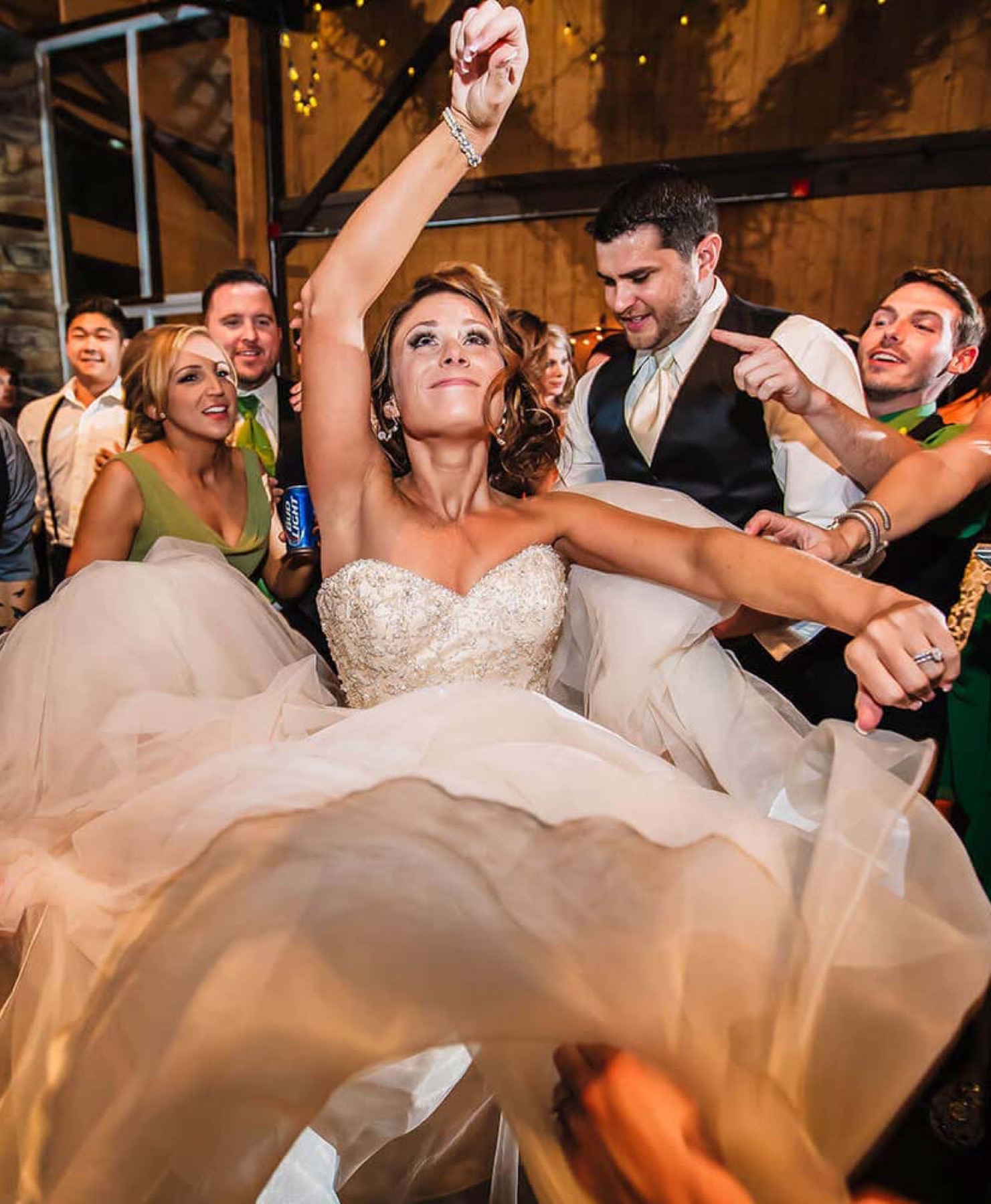 Newlyweds lifted mid dance by their guests