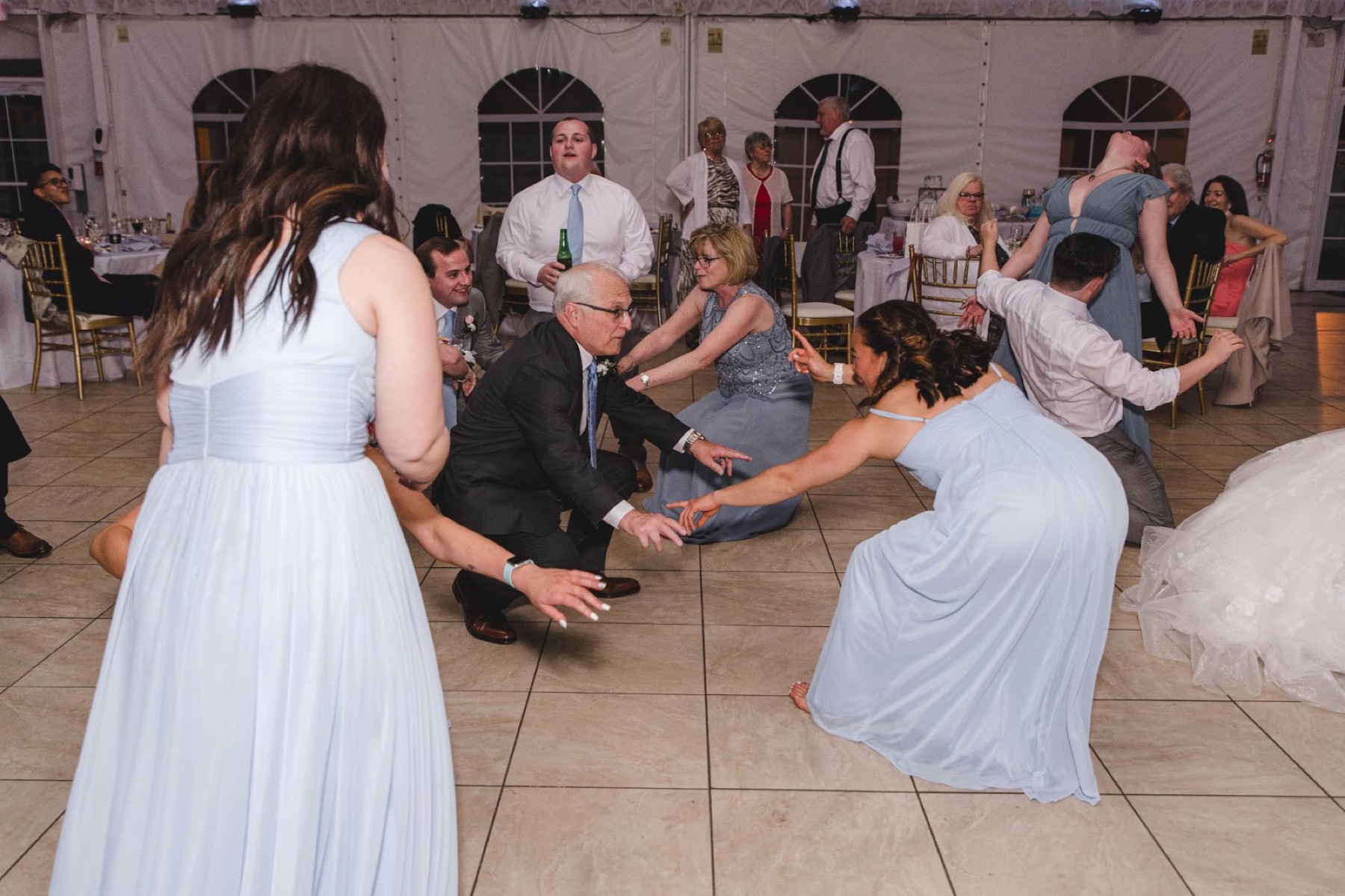 Guests dancing under a tent